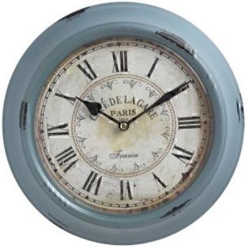 Shabby Chic Vintage Blue Wall Clock by Transomnia. Shabby Chic distressed look clock pained in vintage blue. Clock face has roman numerals on and writing 'café de la gare Paris 1863 France'. Battery operated - batteries not included. 30cm diameter by 